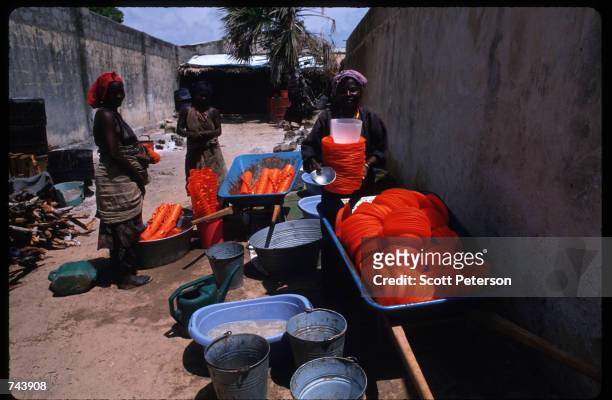Stolen American supplies are sold in a market November 23, 1992 in Kismayo, Somalia. Other stolen supplies sold include wheat and grain.