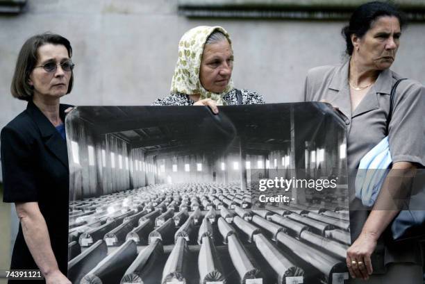 The Hague, NETHERLANDS: -- File photo taken 01 July 2004 shows survivors and relatives of victims of the Srebrenica massacre protesting in The Hague,...