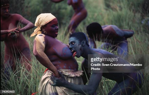 Dancers perform in a 1996 art piece, an African body painting dance performance, organized by Cuba's leading Afro-Cuban artist, Manuel Mendive, in...