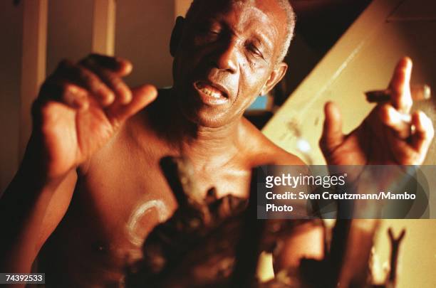 Luis Arere performs an Abacua ceremony in front of a Nganga altar in his home on June 22, 2000 in Centro Havana, Cuba. The fusion and intermingling...