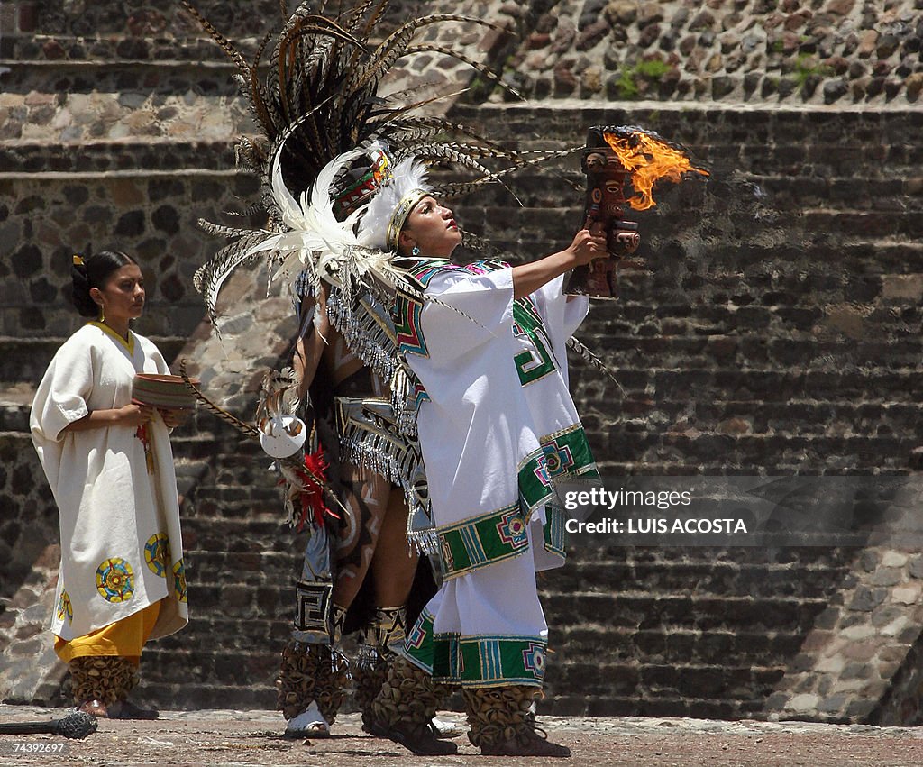 Aztec Ritual Impersonators An actress impersonating an Aztec priestess carries the fire to be ...