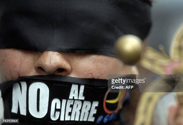 Gagged and blindfolded student takes part 04 June, 2007 in Caracas in a protest march toward the High Court to make a lawsuit in demand of freedom of...