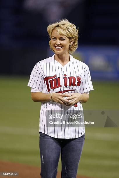 Kelly Carlson, the actress from Nip/Tuck and a Minneapolis native, throws out a ceremonial first pitch before the game between the Minnesota Twins...