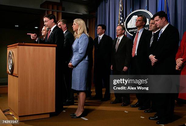 Attorney Chuck Rosenberg of the Eastern District of Virginia speaks as Assistant U.S. Attorney General Alice Fisher looks on at the announcement of a...