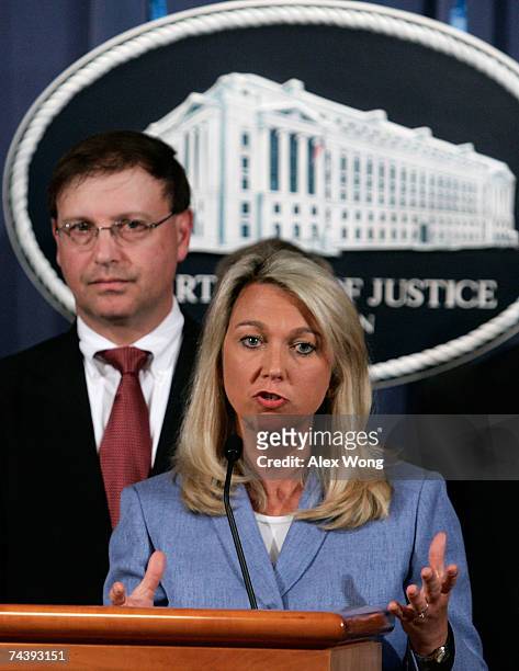 Assistant U.S. Attorney General Alice Fisher speaks as U.S. Attorney Chuck Rosenberg of Eastern District of Virginia looks on during a news...