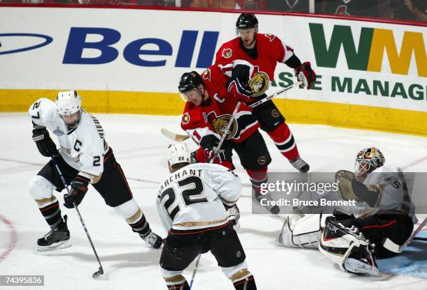 Scott Niedermayer of the Anaheim Ducks gathers the puck after goaltender Jean-Sebastien Giguere made a save against the Ottawa Senators during the...