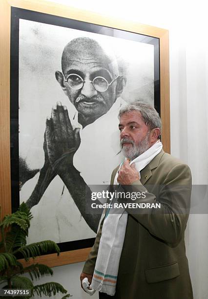 Brazilian President Luiz Inacio Lula da Silva looks at artwork of Mahatma Gandhi during a visit to the Mahatma Gandhi memorial, "Tees January Marg,...