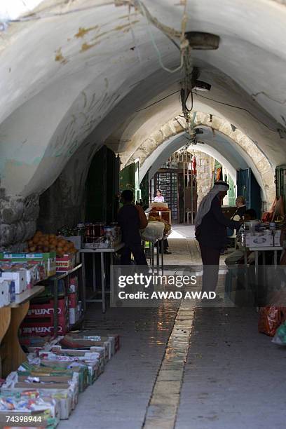 The narrow market streets seem empty as activists of the anti-settlement organisation Peace Now gather during a rally in the divided West Bank town...