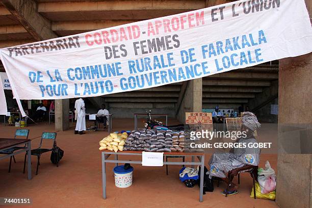 Farmers, artisans, or therapists, show their products at Sissako's "Babemba Traore" stadium, 05 June 2007 as they attend the "People's market" as...