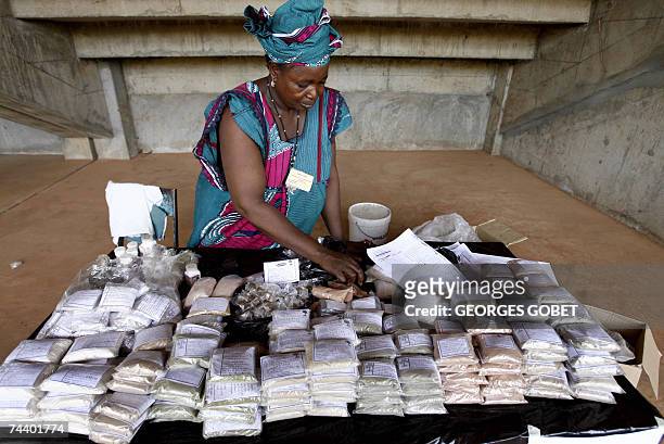 Artisan, or therapist, shows her products at Sissako's "Babemba Traore" stadium, 05 June 2007 as she attends the "People's market" as part of the...