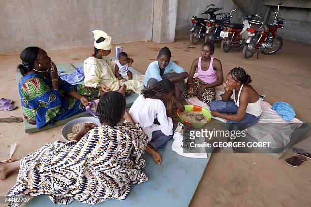 Congressists attending the forum to counter the G8 summit of rich states held in Germany enjoy a common lunch at the "Babemba Traore" stadium in...