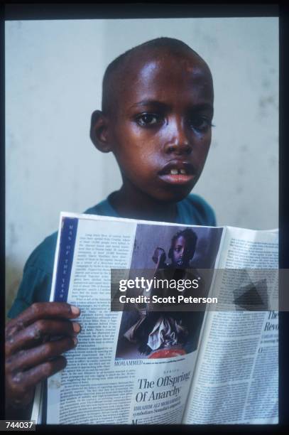 Ibrahim Ali Mohammed displays the Time Magazine article based on his story December 15, 1992 in Baidoa, Somalia. Somalia fell into anarchy after the...