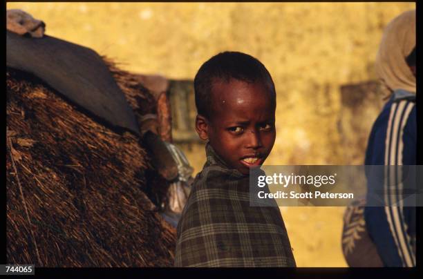 Baidoan child stands December 17, 1992 in Baidoa, Somalia. From August to November 1992, an estimated 21,000 of Baidoa's 37,000 population died in a...