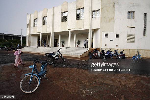 Young woman walks in front of the "Babemba Traore" stadium in Sikasso, Mali, 05 June 2007 during a forum to counter the G8 summit of rich states held...