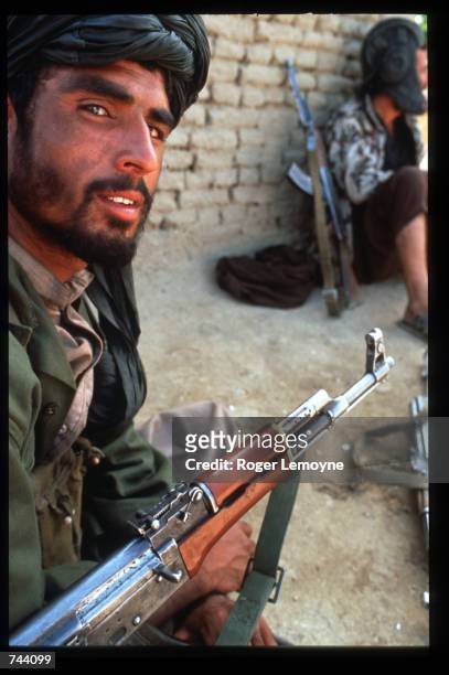 Taliban rebel sits near the Bagram Air Base October 18, 1996 in Kabul, Afghanistan. The Taliban, guerrilla soldiers who identified themselves as...