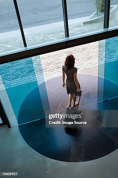 woman leaving hotel - hotel door stock pictures, royalty-free photos & images