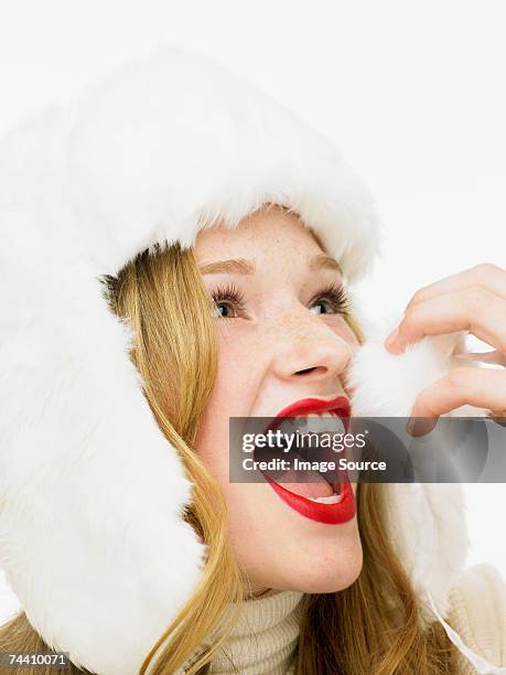 woman trying to eat a bobble - crazy holiday models stock pictures, royalty-free photos & images