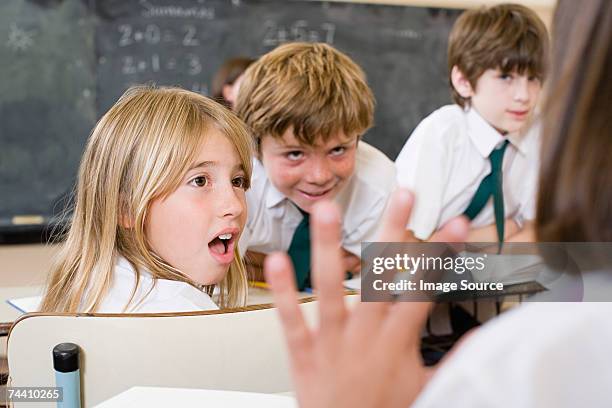 children talking in classroom - mischief stock pictures, royalty-free photos & images