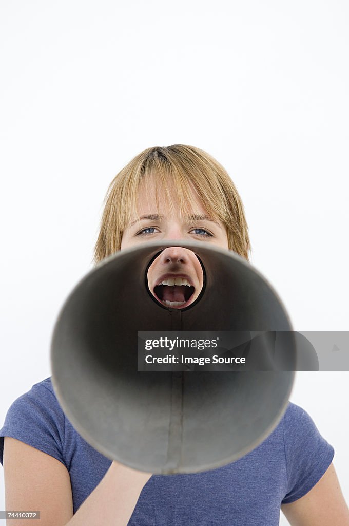 Woman shouting through megaphone