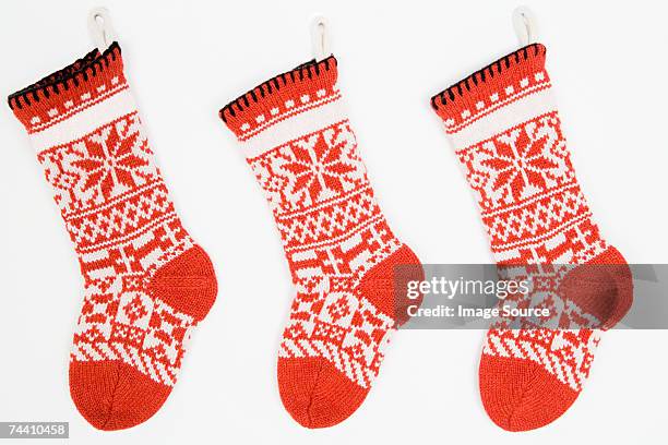 christmas stockings in a row - christmas stockings stock pictures, royalty-free photos & images