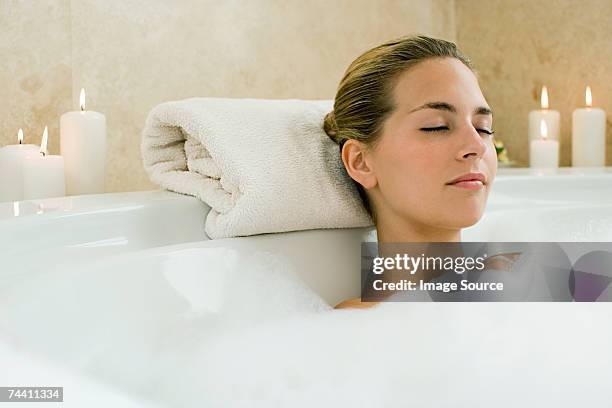 woman bathing - bathtub stock pictures, royalty-free photos & images