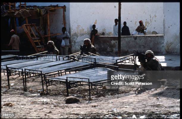 An unidentified group of U.S. Soldiers aim their rifles January 11, 1993 in Mogadishu, Somalia. The United Nations hopes to restore order and save...