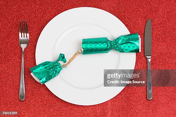 open christmas cracker - christmas cracker stock pictures, royalty-free photos & images