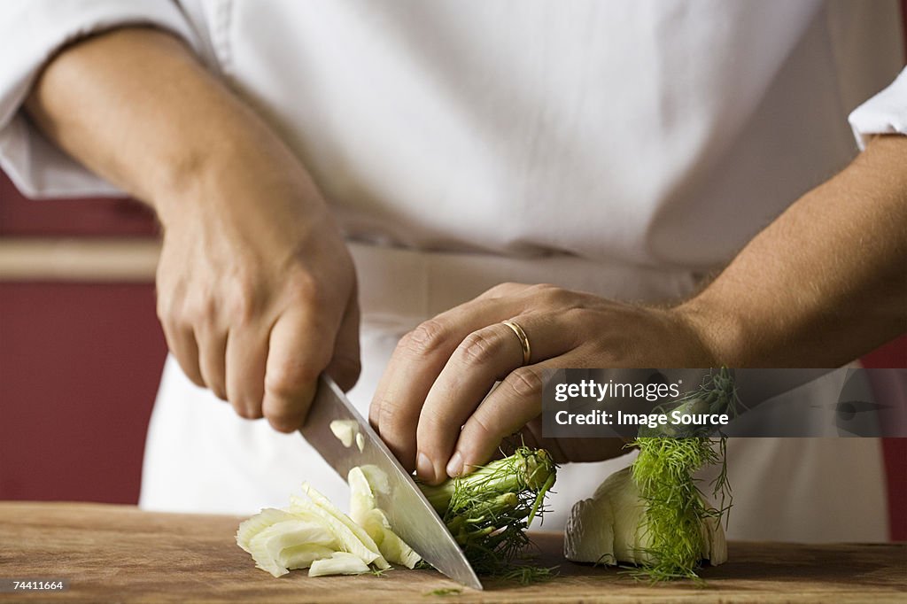 Chef chopping fennel