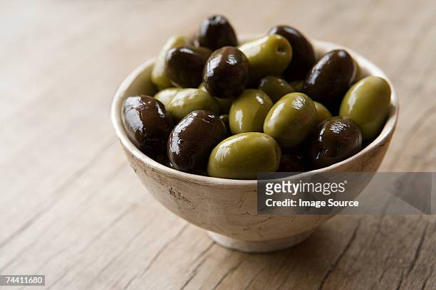 bowl of olives - black olive stock pictures, royalty-free photos & images