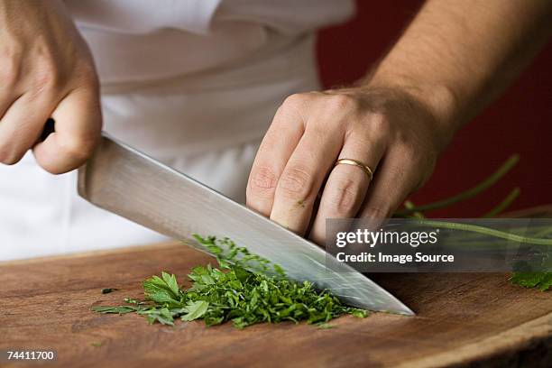 chef chopping parsley - chef smelling food stockfoto's en -beelden