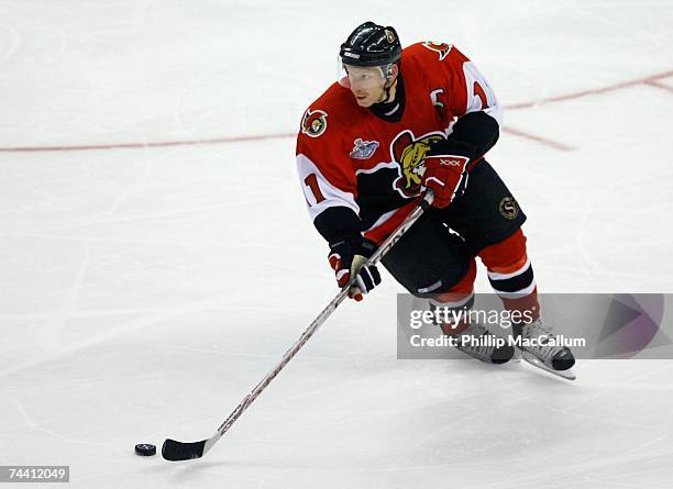 Daniel Alfredsson of the Ottawa Senators skates with the puck against the Anaheim Ducks during Game Four of the 2007 Stanley Cup finals on June 4,...