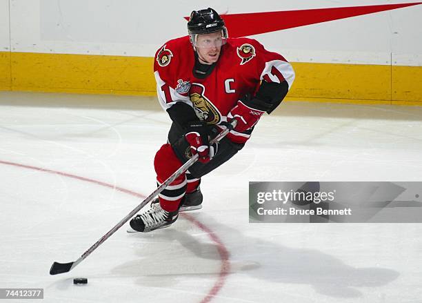 Daniel Alfredsson of the Ottawa Senators skates with the puck against the Anaheim Ducks during Game Four of the 2007 Stanley Cup finals on June 4,...