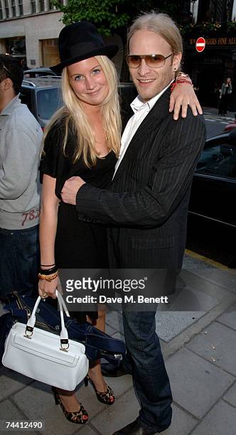 Melissa Montgomery and Jamie Wood attend exhibition by artist Damian Elwes, at the Scream Gallery on June 5, 2007 in London, England.
