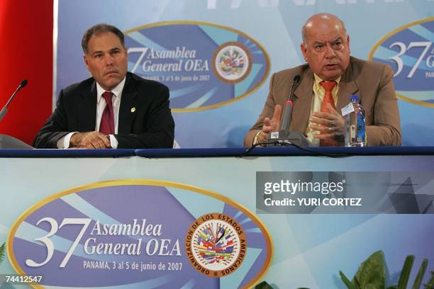 The Secretary General of the Organization of American States Jose Miguel Insulza speaks beside Panamanian Foreign Minister Samuel Lewis during a...