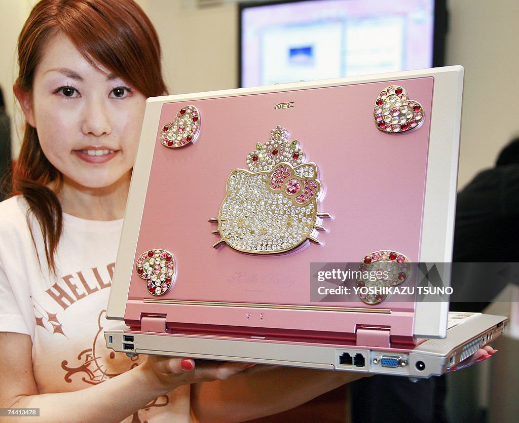 Japan's computer giant NEC employee Ayumi Tamotsu displays the new ...