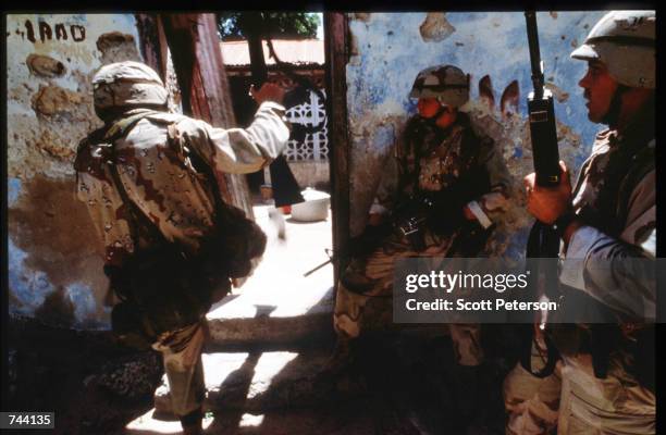 An unidentified group of U.S. Soldiers patrol January 11, 1993 in Mogadishu, Somalia. The United Nations hopes to restore order and save hundreds of...