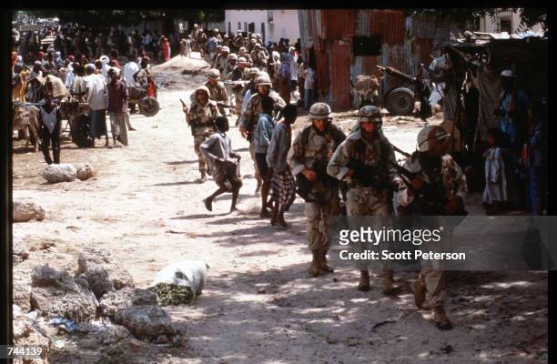 Marines patrol January 11, 1993 in Mogadishu, Somalia. The United Nations hopes to restore order and save hundreds of thousands with the support of...