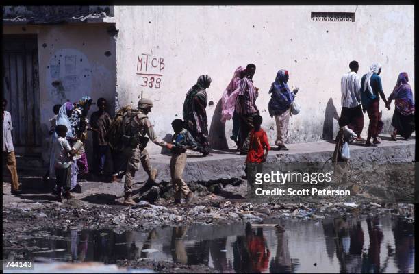 Marines search for weapons and ammunition January 11, 1993 in Mogadishu, Somalia. The United Nations hopes to restore order and save hundreds of...