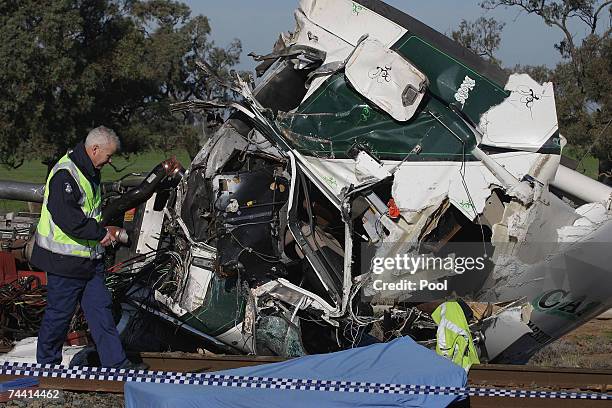 Wreckage of a truck is strewn about the crash scene after a fatal collision with a train yesterday, June 6, 2007 in Kerang, Australia. 10 people have...