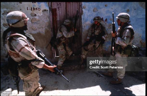 Marines search for weapons and ammunition January 11, 1993 in Mogadishu, Somalia. The United Nations hopes to restore order and save hundreds of...