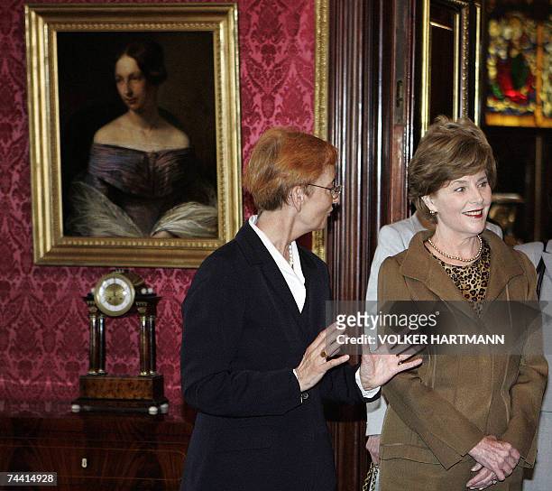The director of Schwerin's Museum Kornelia von Berswordt-Wallrabe guides US First Lady Laura Bush as she visits the castle of the city of Schwerin,...