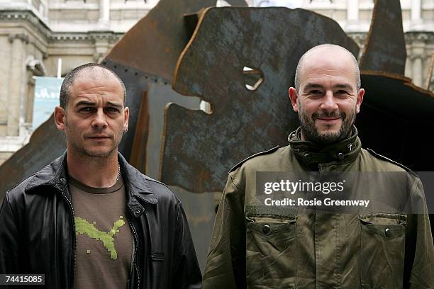 Dinos and Jake Chapman pose beside their artwork 'The Meek Shall Inherit The Earth, But Not The Mineral Rights' at The Royal Academy of Arts 239th...