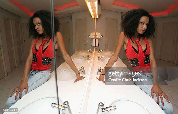 Clubber poses for a photograph in the restrooms of Pasha nightclub in Eivissa town on June 5, 2007 in Ibiza, Spain. Pacha will celebrate its 34th...
