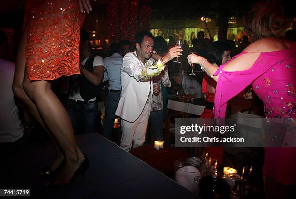 Clubbers drink champagne at Pacha nightclub in Eivissa town on June 5, 2007 in Ibiza, Spain. Pacha will celebrate its 34th birthday tomorrow and has...