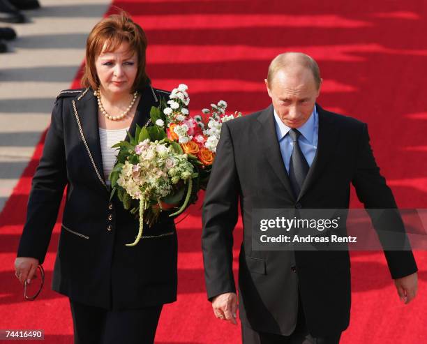 Russian President Vladimir Putin and his wife Ludmila Alexandrowna Putina arrive for the G8 summit June 6, 2007 in Rostock-Laage, Germany. Putin and...