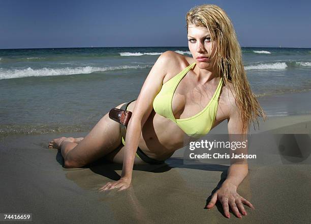Actress Meredith Ostrom poses as Ursula Andress for a portrait session on Playa D'En Bossa beach during the Ibiza and Formentera International film...