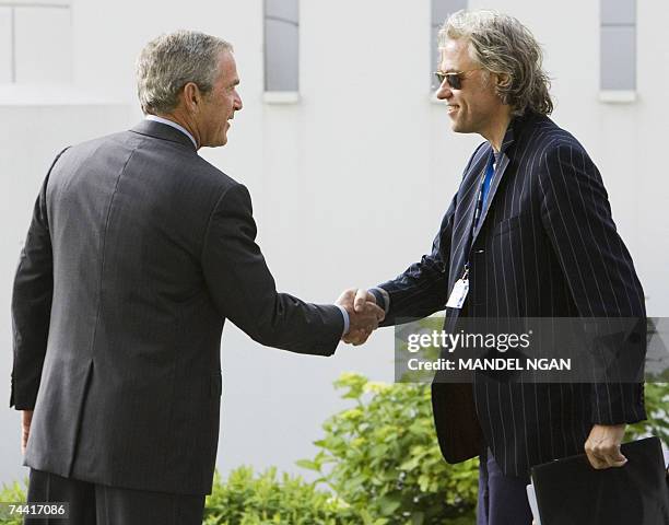 President George W. Bush shakes hands with Irish political activist and musician Bob Geldof 06 June 2007 before a meeting at the on the Baltic Sea...