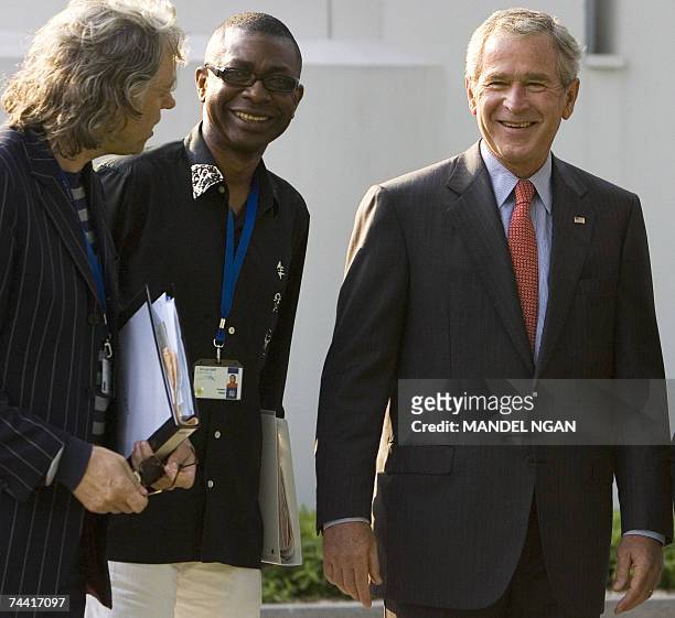 President George W. Bush shares a laugh with Irish political activist and musician Bob Geldof and Senegalese Musician Youssou N'Dour 06 June 2007...