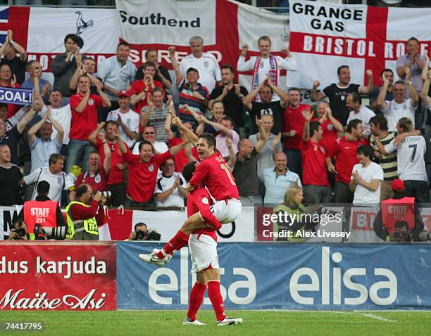 Joe Cole of England celebrates his goal with Wayne Bridge during the Euro 2008 qualifying match between Estonia and England at the A.Le Coq Arena on...