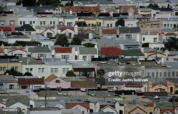 Rows of houses stand June 6, 2007 in San Francisco, California. The National Association of Realtors announced today that it is lowering its forecast...